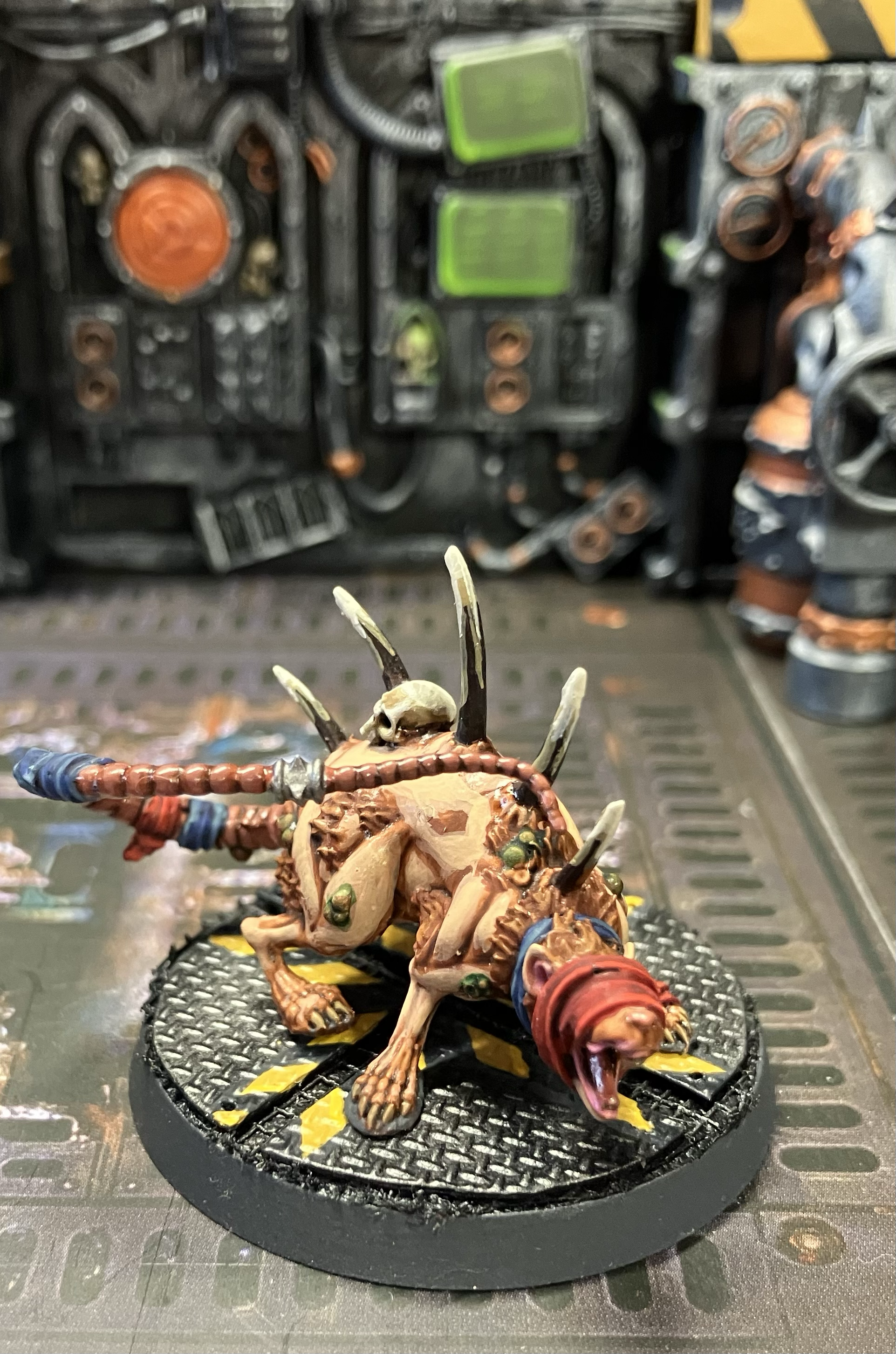A giant hive rat in blue and red bandages.