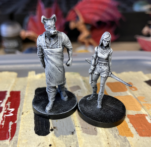 Miniatures prepared for Slap Chop with a black undercoat and dry brushed white.