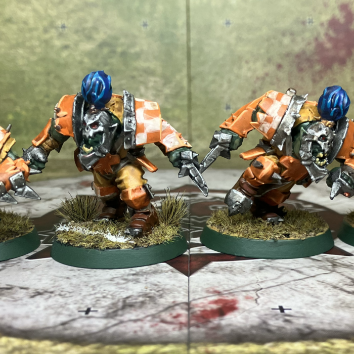 Four Blood Bowl orc blitzers