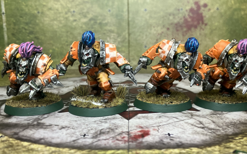 Four Blood Bowl orc blitzers