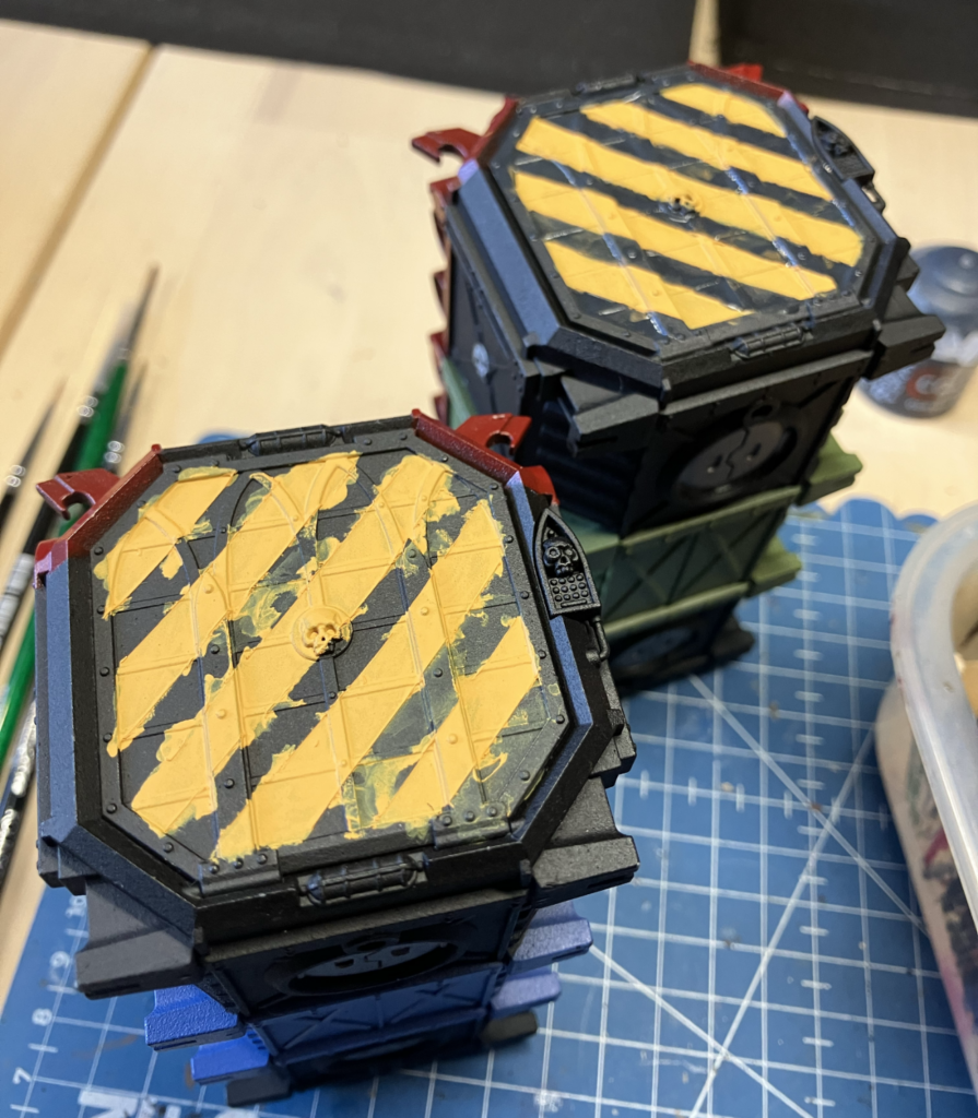 Two Munitorum Containers with the masking removed and rough result