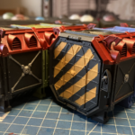 Two Munitorum Containers with their hazard stripes cleaned up.