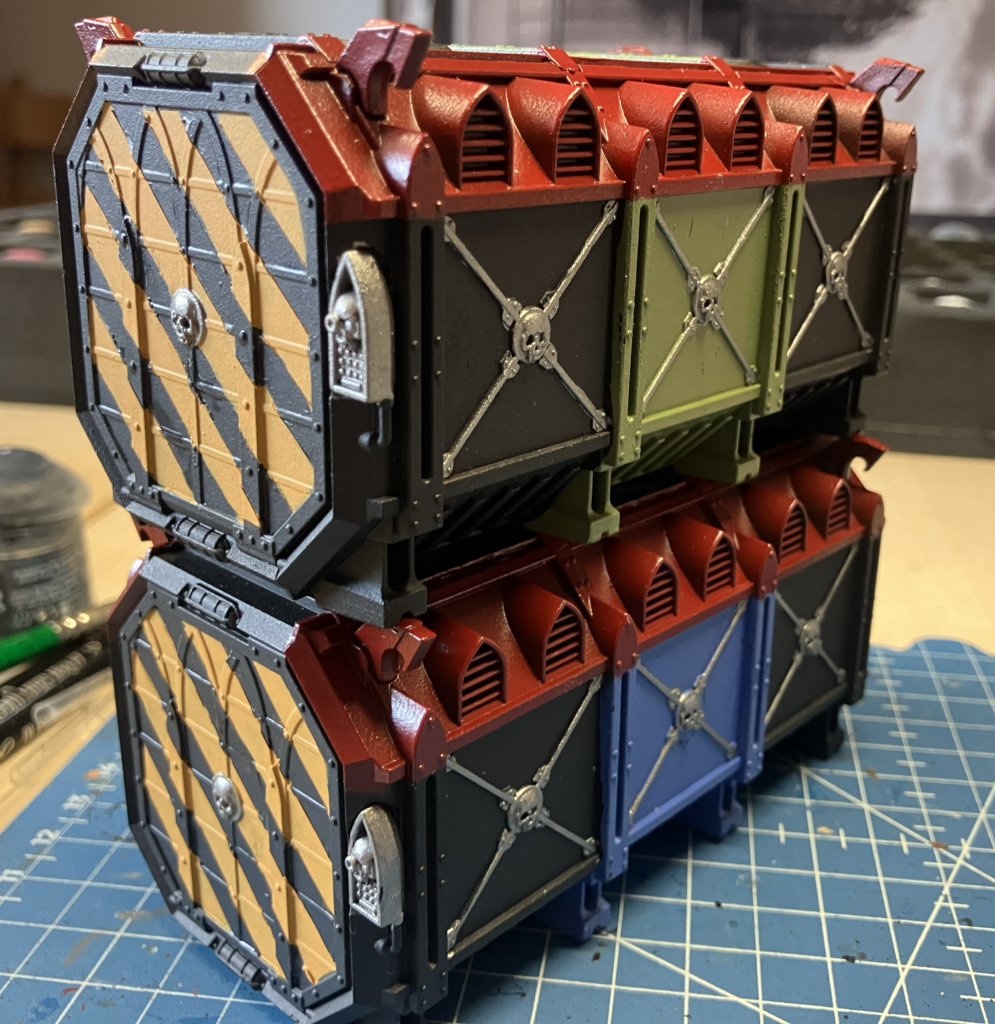 Two Munitorum Containers with their hazard stripes cleaned up.