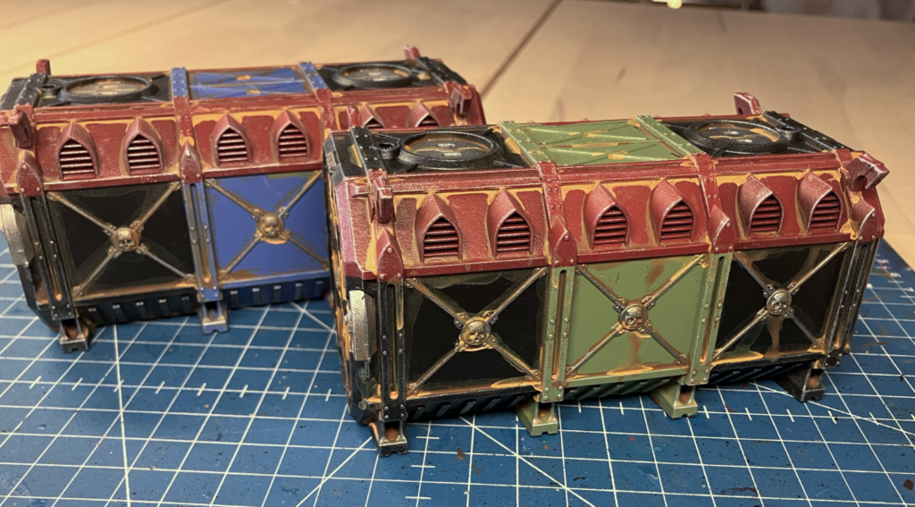 Two finished Munitorum Containers, painted and aged.