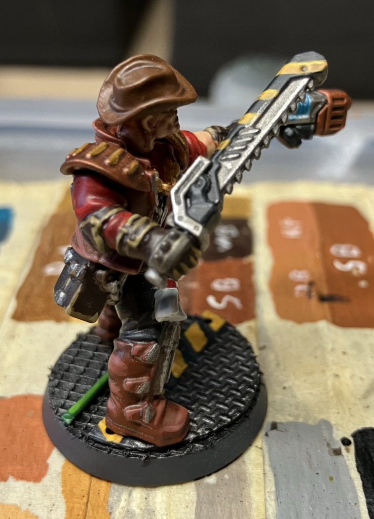 An Orlock leader who had a standard Orlock chainsword hand-switched.